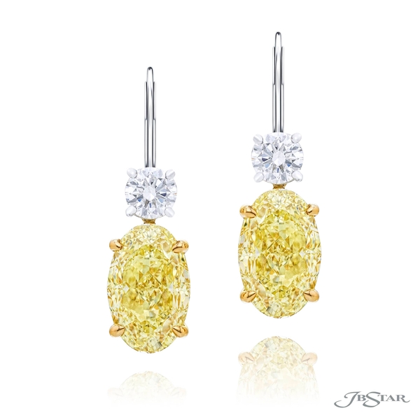 Fancy yellow earrings featuring 2 gorgeous fancy yellow oval center diamonds with a round diamonds on top.1199-114