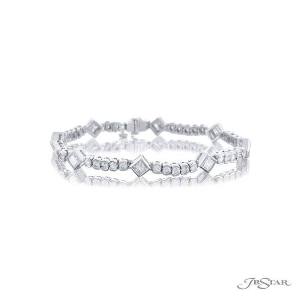 Diamond bracelet featuring pear and round diamonds in a half bezel design. 0559-001