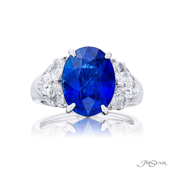 Sapphire and diamond ring featuring a 7.06 ct. GIA certified oval sapphire center embraced by a cluster oval pear-shape of marquise diamonds. 7603-003