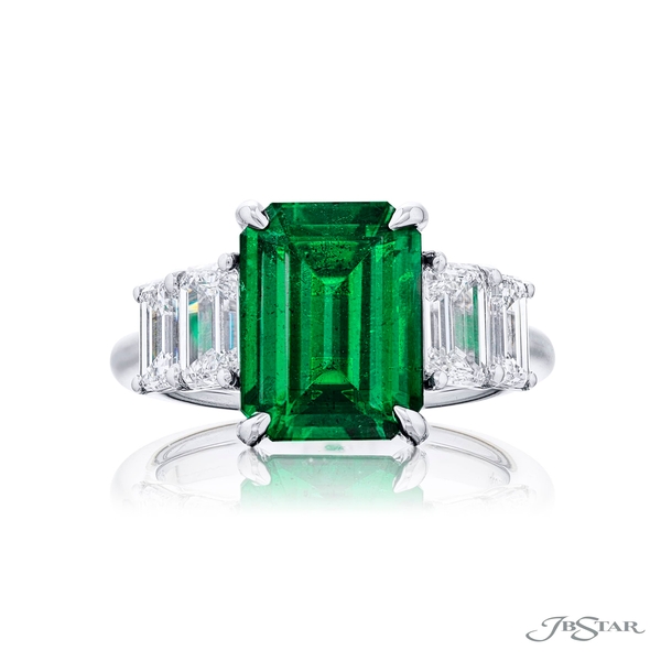 Emerald and diamond ring featuring a 3.85 ct.emerald cut emerald embraced by two matching emerald diamonds.5855-002