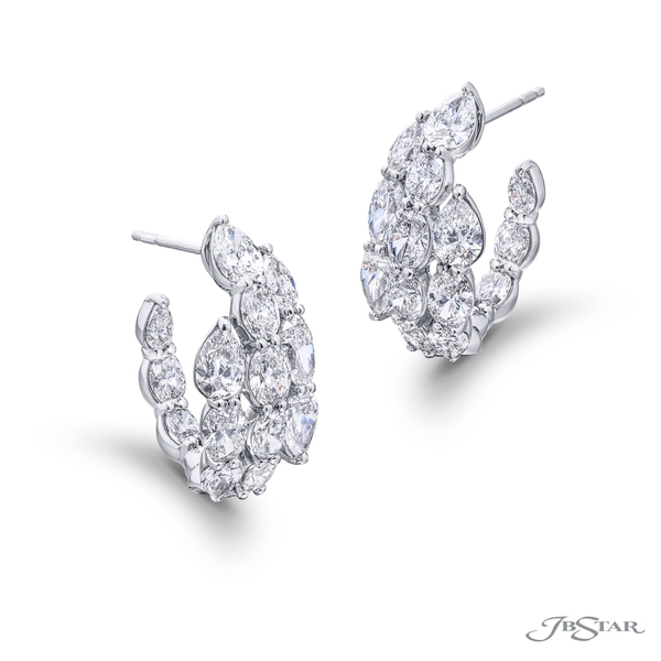 Unique diamond hoop earrings featuring 28 brilliant oval-cut and pear shape diamonds in a shared prong setting. Handcrafted in pure platinum.3268-003