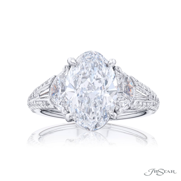 3.17 ct. GIA certified oval diamond center set between half moon and tapered baguette diamonds in a micro pave setting. 5658-007