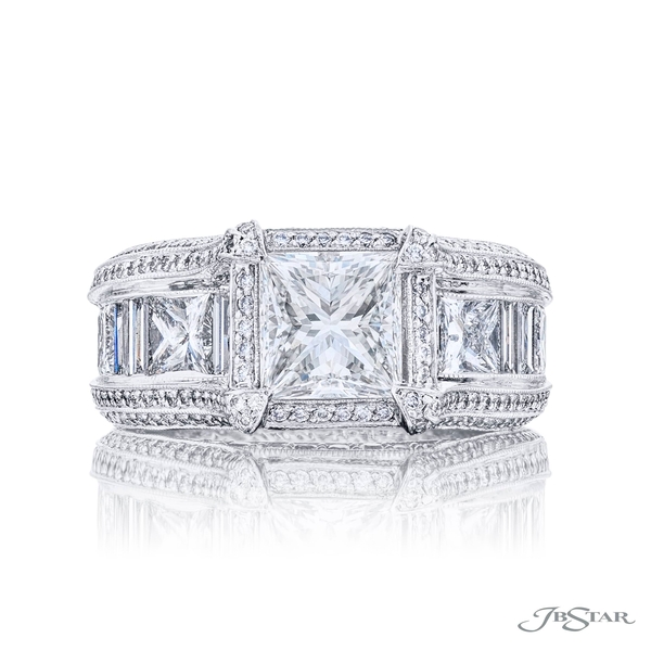 1.70ct princess-cut center. Either side is set with princess-cut and baguette diamonds in a center channel and edged in round diamond pave. 1800-001