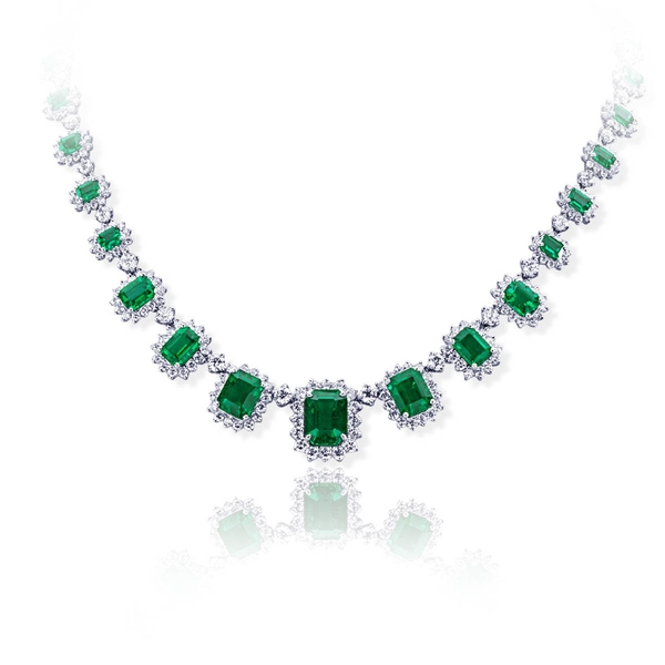 18.59 emerald cut emerald and halo diamond necklace.jpg