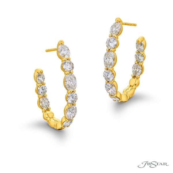 Diamond hoop earrings featuring 18 oval-cut and round diamonds. Handcrafted in 18k gold.7318-002
