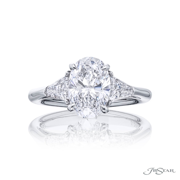2.03 ct. GIA certified oval diamond center embraced by two tapered baguette diamonds. 4398-217