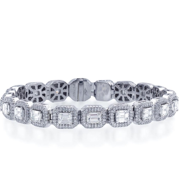 Impeccable diamond bracelet features 20 emerald cut diamonds edged in round diamond pave.jpg