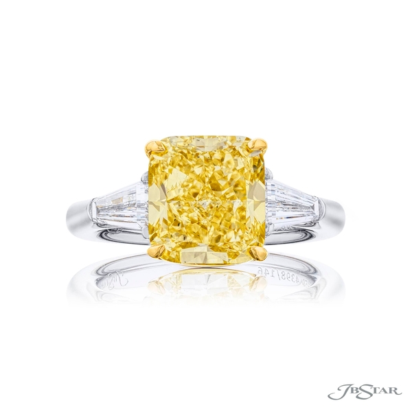 5.21 ct. GIA certified cushion-cut fancy yellow diamond embraced by tapered baguette diamonds.4398-146