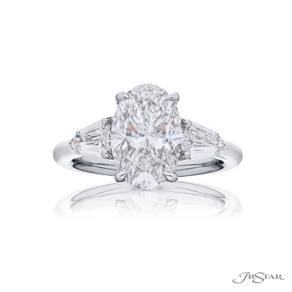 2.50 ct oval-cut diamond GIA certified set between two shield diamonds in a channel setting. 1219-092