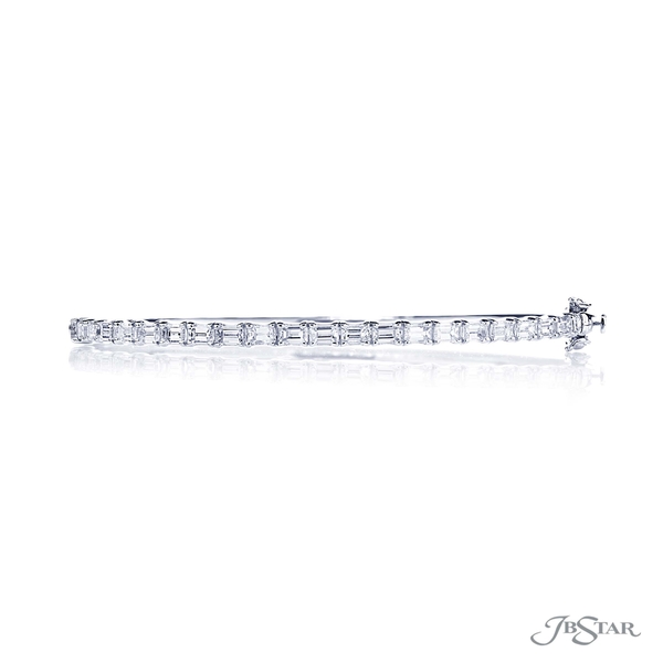 Diamond bangle featuring 21 beautifully matched emerald-cut diamonds in a shared prong setting. 1967-003