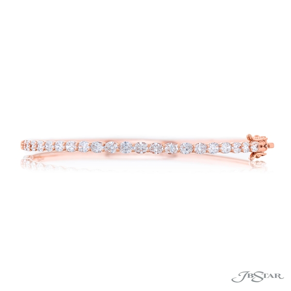 Diamond bangle featuring perfectly matched oval diamonds in a shared prong setting. 1966-001