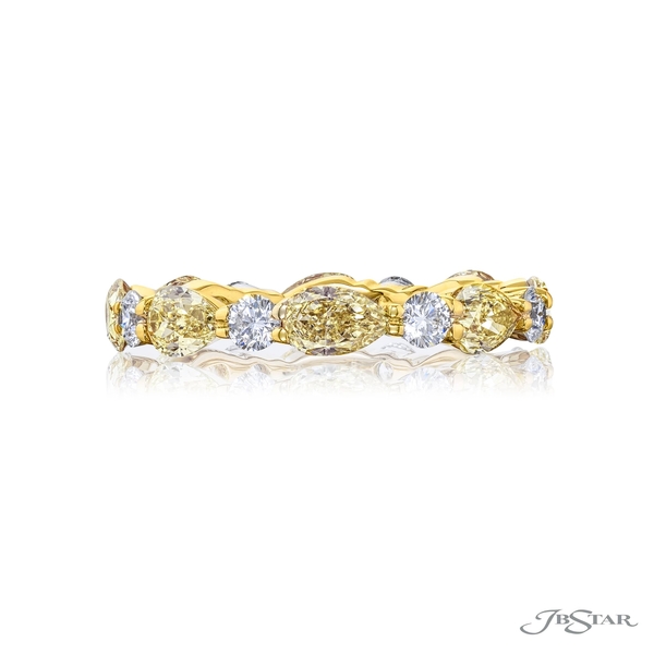 Diamond eternity band featuring fancy yellow pear-shaped diamonds and round white diamonds in a shared prong setting. Handcrafted in 18KY gold.6072-002