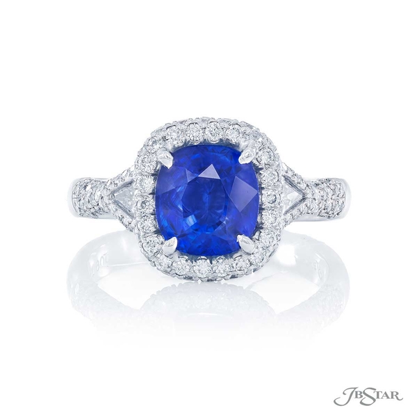 Sapphire and diamond ring featuring a 2.12 ct. cushion-cut sapphire accompanied by kite diamonds in a micro pave setting.0490-060