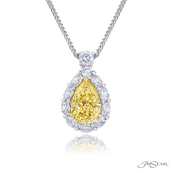 Fancy yellow and diamond pendant featuring a 3.60 ct. GIA certified pear shaped fancy yellow encircled by oval and round diamonds. 0512-057