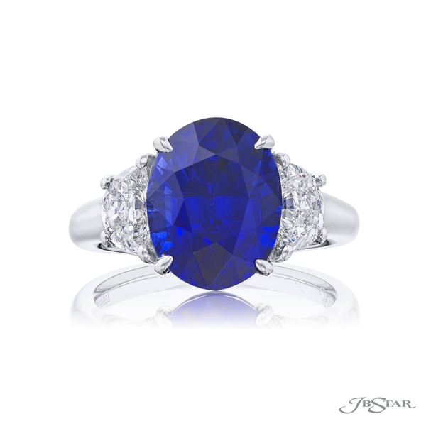 Sapphire and diamond ring featuring a 6.73 ct. certified oval-cut sapphire embraced by two matching diamonds.7499-007