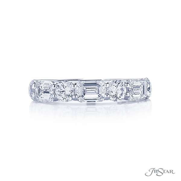 Wedding band featuring 3 emerald cut diamonds and 4 round diamonds in alternating shared prong setting. 5439-001