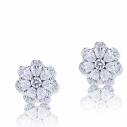 Beautiful diamond stud earrings featuring pear shape and round diamonds..jpg