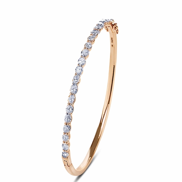 diamond bangle featuring perfectly matched oval diamonds in a shared prong setting.jpg