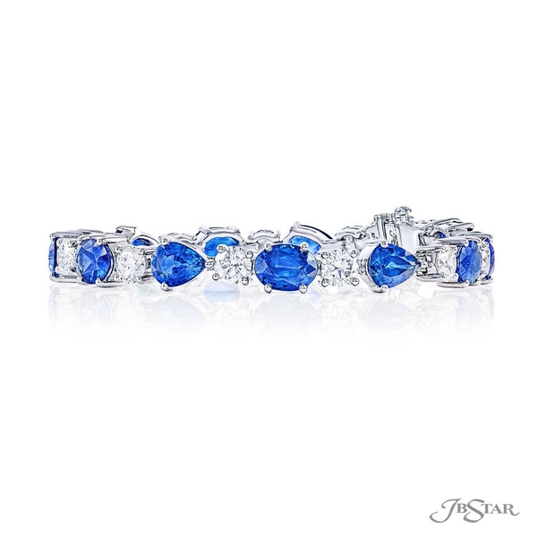 Sapphire and diamond bracelet featuring oval and pear shaped blue sapphires accompanied by round diamonds. 5705-001