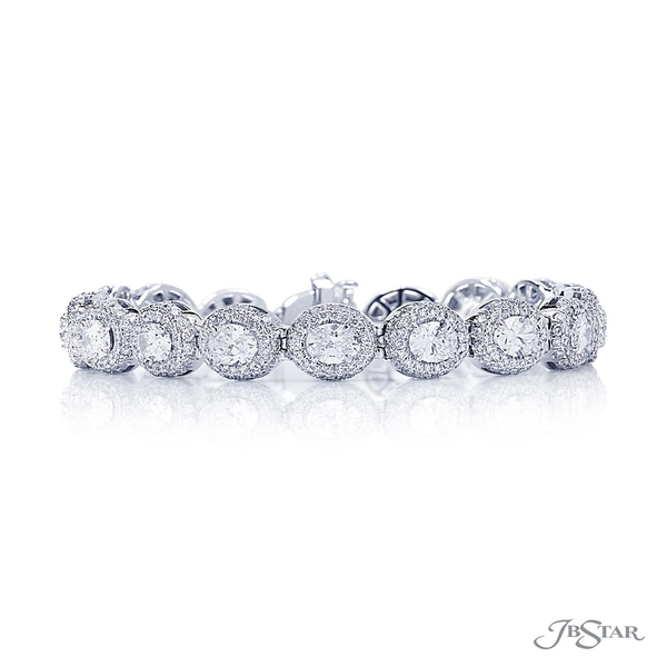 Diamond bracelet featuring 19 perfectly matched oval diamonds in surrounded by round diamond pave. 1989-001