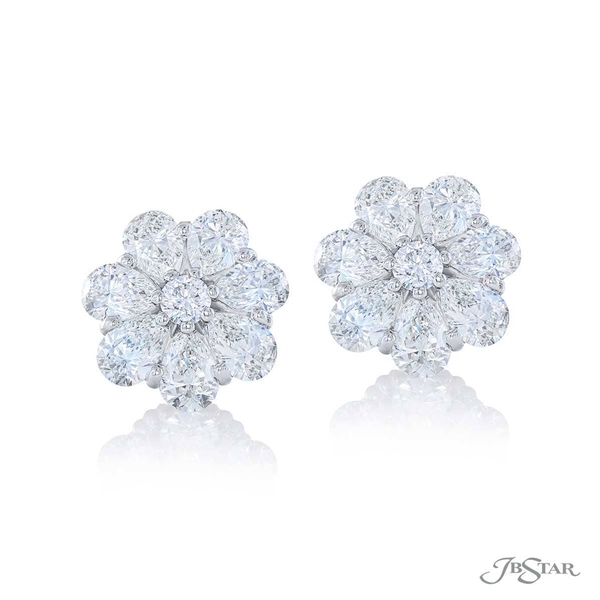 Diamond stud earrings featuring pear shape and round diamonds. 5328-003