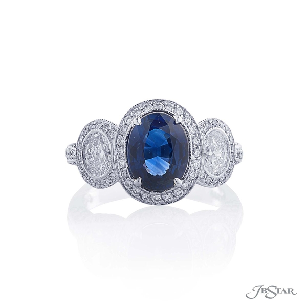 Sapphire and diamond ring featuring a gorgeous 2.61 ct. oval sapphire embraced with 2 oval diamonds in a micro pave setting.1359-060