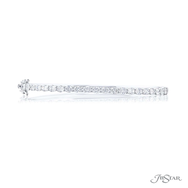 Diamond bangle featuring perfectly matched oval diamonds in a shared prong East to West setting. 1966-004_1