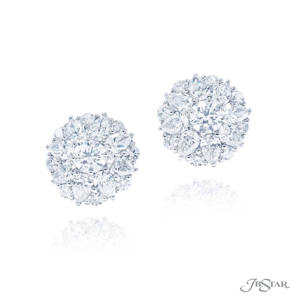 Diamond stud earrings featuring round diamond centers encircled by pear shape and round diamonds. Handcrafted in pure platinum.5336-003