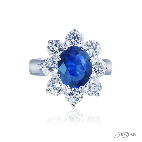 Sapphire and diamond ring featuring a 2.40 ct. oval sapphire encircled by round diamonds. 0819-015