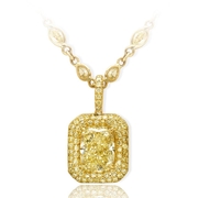 fancy light yellow diamond pendant featuring a striking 3.83 ct. GIA certified cushion cut fancy light yellow diamond edged with round fancy yellow diamond pave.jpg