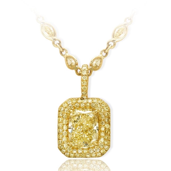 fancy light yellow diamond pendant featuring a striking 3.83 ct. GIA certified cushion cut fancy light yellow diamond edged with round fancy yellow diamond pave.jpg