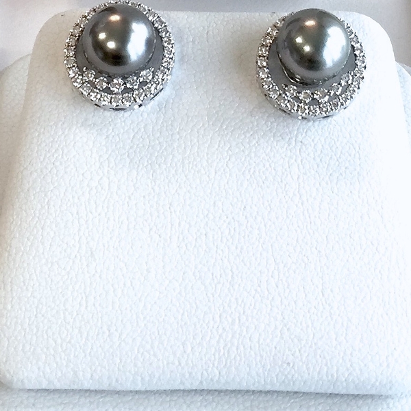 Black Tahitian pearls with diamond jackets