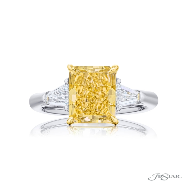 3.03 ct. GIA certified radiant-cut fancy yellow diamond embraced by tapered baguette diamonds. 4398-195