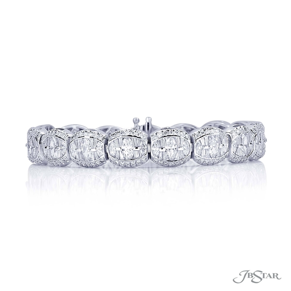 Diamond bracelet featuring marquise and tapered baguette diamonds in a channel setting with micro pave diamonds. 0318-002