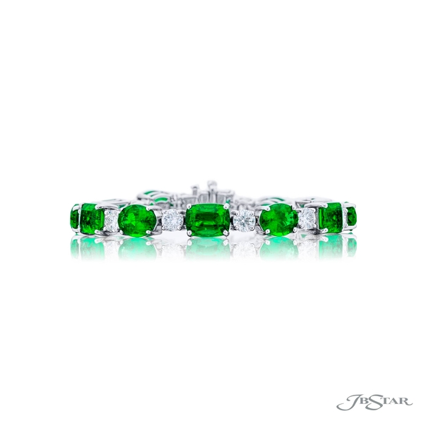 Emerald and diamond bracelet featuring 12 oval pear and emerald-cut emeralds and 12 brilliant round diamonds.3267-004