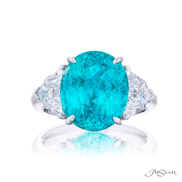 Paraiba and diamond ring featuring a 8.17 cttw oval paraiba embraced between 2 perfectly matched epaulette diamonds.0283-076