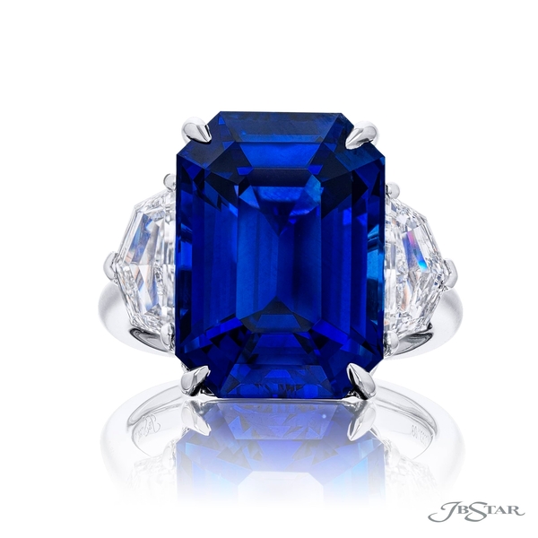 Sapphire ring featuring a certified 17.08 ct vivid blue sapphire from Sri Lanka embraced by epaulette diamonds. 0283-103