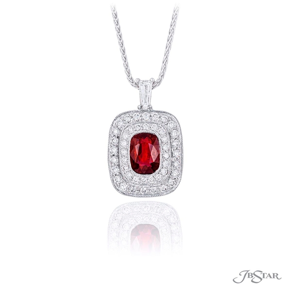 Ruby and diamond pendant featuring a 1.83 ct. cushion-cut ruby encircled by round diamond pave and hung by a tapered baguette diamonds.1644-026