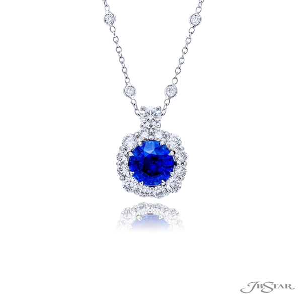 Sapphire and diamond pendant featuring a 3.39 ct. certified round sapphire embraced by perfectly matched round diamonds. 1167-004