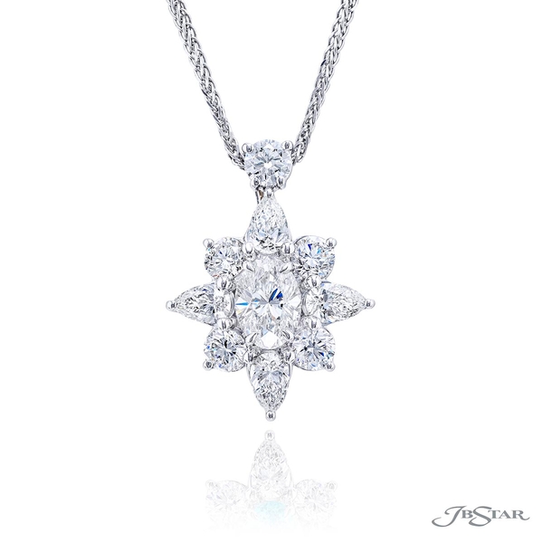 Diamond pendant featuring a 0.91 ct. GIA certified oval diamond center encircled by round and oval diamonds.1647-007