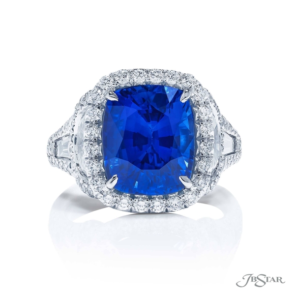 Sapphire and diamond ring featuring a 6.96 ct. cushion-cut certified vivid blue sapphire center embraced by half moon and tapered baguette diamonds.7391-001