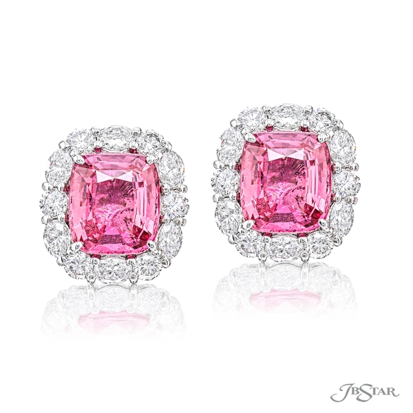 Sapphire and diamond studs featuring 2 CDC certified pink cushion-cut sapphires encircled by oval and round diamonds in a shared prong setting. 7289-004