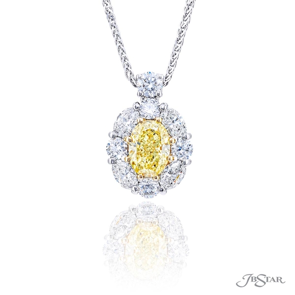 Fancy yellow diamond pendant featuring a GIA certified 1.56 ct. oval fancy yellow diamond center encircled by oval and round diamonds and hung by a round diamond.2366-018