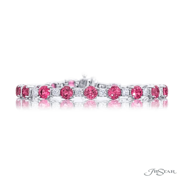 Pink sapphire and diamond bracelet featuring round sapphires and round diamonds in a shared prong setting.1067-007