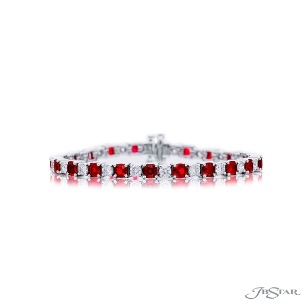 Ruby and diamond bracelet featuring 22 round Burmese rubies with brilliant round diamonds in a shared prong setting.5942-002