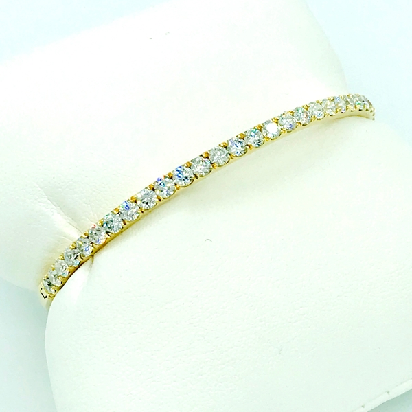 round brilliant cut diamond and yellow gold bangle bracelet