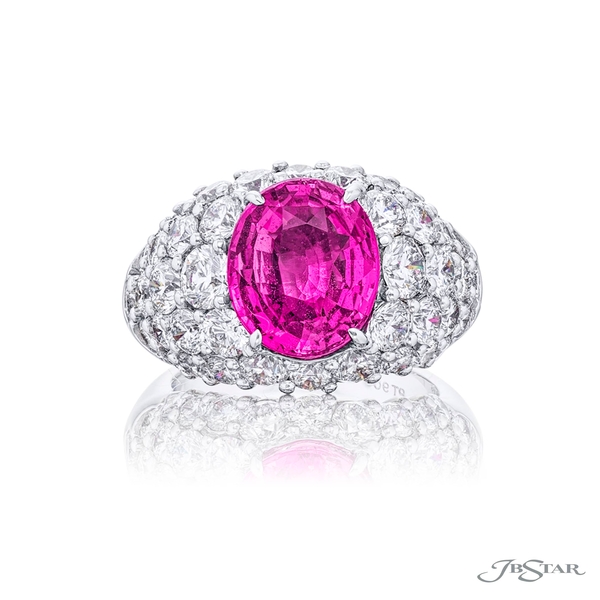 Pink sapphire and diamond ring featuring a 5.11 ct. GIA certified oval pink sapphire embraced by rows of round diamonds.2057-001