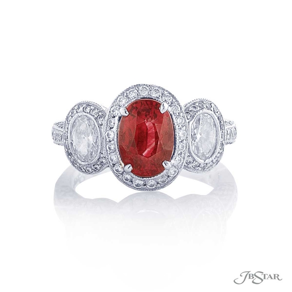 Ruby and diamond ring featuring a 1.51ct oval ruby center embraced by two oval diamonds in a micro pave setting.1359-038