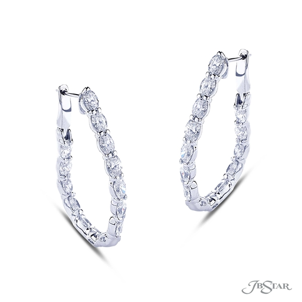 Diamond hoop earrings featuring 28 perfectly matched oval diamonds in a shared prong setting.5536-001