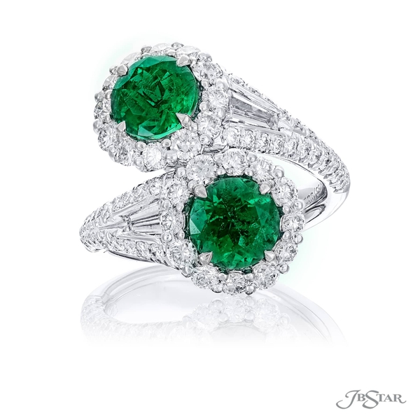 Ring featuring 2 certified round emeralds embraced by tapered baguette diamonds in a micro pave setting. 5753-001